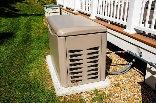 Standby generator in front of Wausau, WI home's porch.